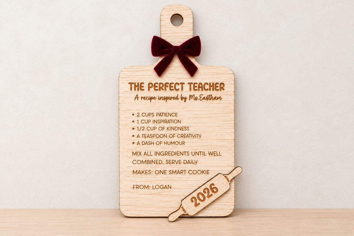 'The perfect teacher' board with rolling pin